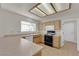 U-shaped kitchen features neutral cabinets, countertop, and appliances at 9013 Litchfield Ave, Las Vegas, NV 89134