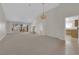 Bright living room featuring high ceilings, a cozy fireplace, and sliding doors leading to the backyard at 9013 Litchfield Ave, Las Vegas, NV 89134