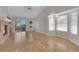 Open living room featuring tile flooring, brick fireplace, and natural light at 9013 Litchfield Ave, Las Vegas, NV 89134