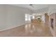 Living room features tile flooring, fireplace, and view of kitchen area at 9013 Litchfield Ave, Las Vegas, NV 89134