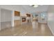 Spacious living area with fireplace, built-in shelving, and sliding glass door to backyard at 9013 Litchfield Ave, Las Vegas, NV 89134