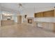 Open-concept living space with kitchen, fireplace, and built-in desk area at 9013 Litchfield Ave, Las Vegas, NV 89134