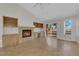 Living room with fireplace, built-in cabinets and shelving, and a sliding glass door at 9013 Litchfield Ave, Las Vegas, NV 89134