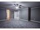 Spacious bedroom offers neutral walls, plush carpeting and a ceiling fan for added comfort at 913 Evening Fawn Dr, North Las Vegas, NV 89031