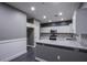 Well-lit kitchen boasts white cabinets, tile backsplash and stainless steel appliances at 913 Evening Fawn Dr, North Las Vegas, NV 89031