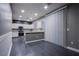Bright kitchen features recessed lighting, white cabinets and stainless steel appliances at 913 Evening Fawn Dr, North Las Vegas, NV 89031