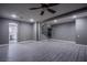 Open living room with sleek flooring, recessed lighting, and convenient access to the kitchen and staircase at 913 Evening Fawn Dr, North Las Vegas, NV 89031