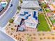 Stunning aerial view of the home's backyard featuring a lush green lawn and solar panels at 940 Riverlawn Pl, Las Vegas, NV 89138