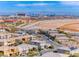 Panoramic aerial view of the community showcasing the Las Vegas skyline and mountain views at 940 Riverlawn Pl, Las Vegas, NV 89138