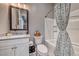 Bathroom featuring single sink vanity and shower-tub combo at 940 Riverlawn Pl, Las Vegas, NV 89138
