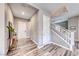Welcoming entryway with hardwood floors and elegant staircase, creating a lasting impression at 940 Riverlawn Pl, Las Vegas, NV 89138