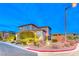 Well-manicured front yard with desert landscaping and an inviting exterior view of the modern home at 940 Riverlawn Pl, Las Vegas, NV 89138