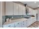 Updated kitchen with modern appliances, sleek countertops, and stylish backsplash at 940 Riverlawn Pl, Las Vegas, NV 89138