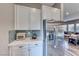 Bright kitchen featuring stainless steel appliances, ample counter space, and a view to the living area at 940 Riverlawn Pl, Las Vegas, NV 89138