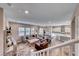 Spacious living room flowing into the open concept kitchen with ample seating and natural light at 940 Riverlawn Pl, Las Vegas, NV 89138