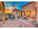 Inviting patio with comfortable seating, outdoor dining, and a charming pergola at 940 Riverlawn Pl, Las Vegas, NV 89138