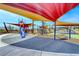 Community playground featuring colorful sunshades, slides, and play equipment for enjoyment at 940 Riverlawn Pl, Las Vegas, NV 89138