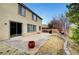 Spacious backyard boasts an outdoor patio and lush landscaping at 10247 Gladstone Peak St, Las Vegas, NV 89166