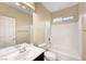 The bathroom features a tub-shower combination, a single sink vanity, and a neutral color palette at 10247 Gladstone Peak St, Las Vegas, NV 89166