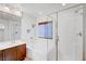 Bright bathroom with a soaking tub, glass shower and vanity sink at 10247 Gladstone Peak St, Las Vegas, NV 89166