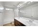 Bathroom with double sinks and a shower-tub combo at 10247 Gladstone Peak St, Las Vegas, NV 89166