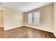 Bedroom with wood floors and shuttered windows at 10247 Gladstone Peak St, Las Vegas, NV 89166
