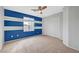 Bedroom with blue accent wall, ceiling fan, and a sliding door closet at 10247 Gladstone Peak St, Las Vegas, NV 89166