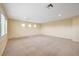 Large bonus room with neutral carpeting, recessed lighting, and bright, sun-lit windows at 10247 Gladstone Peak St, Las Vegas, NV 89166