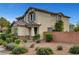 Charming two-story home with a landscaped front yard and brick fence at 10247 Gladstone Peak St, Las Vegas, NV 89166