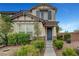 Charming two-story home with a landscaped front yard and inviting entrance at 10247 Gladstone Peak St, Las Vegas, NV 89166