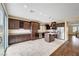 Kitchen with granite counters, island, and access to backyard at 10247 Gladstone Peak St, Las Vegas, NV 89166