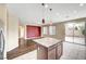 An island with granite countertops separates the kitchen and living area in this spacious open-concept layout at 10247 Gladstone Peak St, Las Vegas, NV 89166