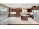 Kitchen with stainless appliances and dark wood cabinetry at 10247 Gladstone Peak St, Las Vegas, NV 89166