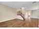 Spacious living room featuring wood floors, a staircase, and neutral paint at 10247 Gladstone Peak St, Las Vegas, NV 89166