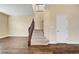 Carpeted stairway with wood banister and railing leading to the second floor of the house at 10247 Gladstone Peak St, Las Vegas, NV 89166