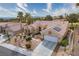 Stunning aerial view of a single-story home with a tile roof, desert landscaping, and mountain views at 10421 Shoalhaven Dr, Las Vegas, NV 89134