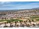 Expansive aerial view showcases a neighborhood near a golf course, featuring well-maintained homes at 10421 Shoalhaven Dr, Las Vegas, NV 89134