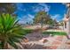 Beautifully landscaped backyard with desert plants and decorative rocks overlooking the golf course at 10421 Shoalhaven Dr, Las Vegas, NV 89134