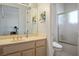 Clean bathroom with a shower, toilet and vanity with a sink, plus neutral tones for a calming experience at 10421 Shoalhaven Dr, Las Vegas, NV 89134