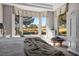 Bright bedroom with a large bay window overlooking the green landscape, providing a tranquil and scenic view at 10421 Shoalhaven Dr, Las Vegas, NV 89134