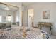 Light-filled bedroom with mirrored closet doors and a pretty vanity, offering a peaceful retreat at 10421 Shoalhaven Dr, Las Vegas, NV 89134