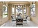 Charming breakfast nook with beautiful views and elegant chandelier, perfect for enjoying morning meals at 10421 Shoalhaven Dr, Las Vegas, NV 89134