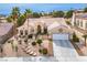 Inviting single-story home with a tile roof, desert landscaping, and a pristine two-car garage at 10421 Shoalhaven Dr, Las Vegas, NV 89134