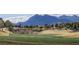 Scenic golf course with lush green grass and mountain views in the background at 10421 Shoalhaven Dr, Las Vegas, NV 89134