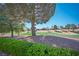 Scenic golf course view framed by lush green hedges and mature trees at 10421 Shoalhaven Dr, Las Vegas, NV 89134