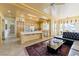 Open kitchen and living area with light cabinetry and a center island with a cooktop at 10421 Shoalhaven Dr, Las Vegas, NV 89134
