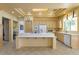 Kitchen with bright cabinets, center island, and a sunlit breakfast area at 10421 Shoalhaven Dr, Las Vegas, NV 89134