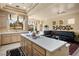 Spacious kitchen with a center island, tile flooring, and adjacent breakfast nook at 10421 Shoalhaven Dr, Las Vegas, NV 89134