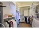 Spacious walk-in closet with custom shelving and ample storage, perfect for organizing wardrobe and accessories at 10421 Shoalhaven Dr, Las Vegas, NV 89134