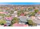 An aerial view of the neighborhood, featuring rooftops and distant mountain scenery at 10924 Bandol Pl, Las Vegas, NV 89141